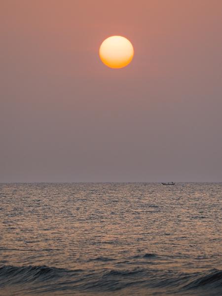A stunning sunrise on Besant Nagar beach, the full disk of the sun rose above the mornings fishermen.